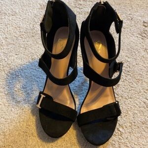 Women’s black heels; size 8